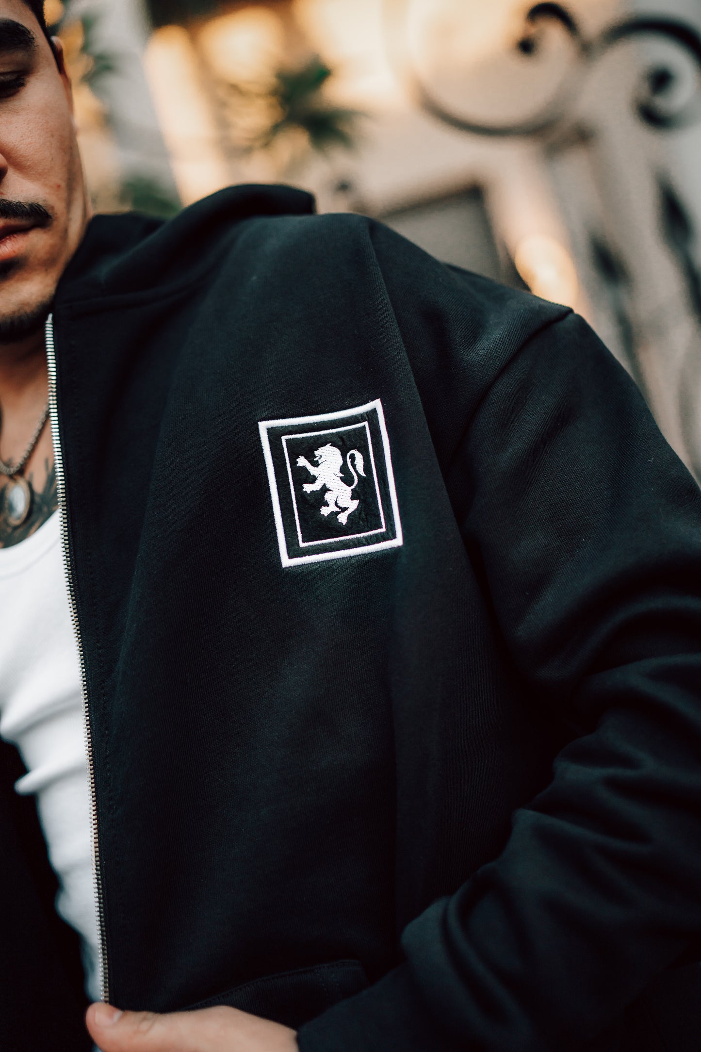 Black zip hoodie with patch